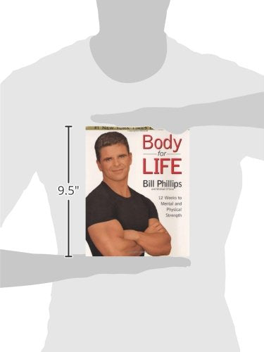 Book titled 'Body for Life' by Bill Phillips held by a person wearing a white t-shirt.