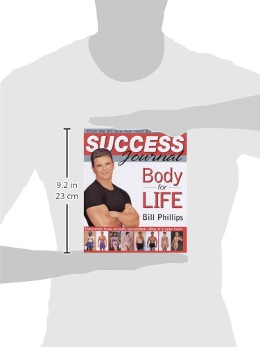 Book titled 'Success Journal: Body for Life' by Bill Phillips held by a person against a white background