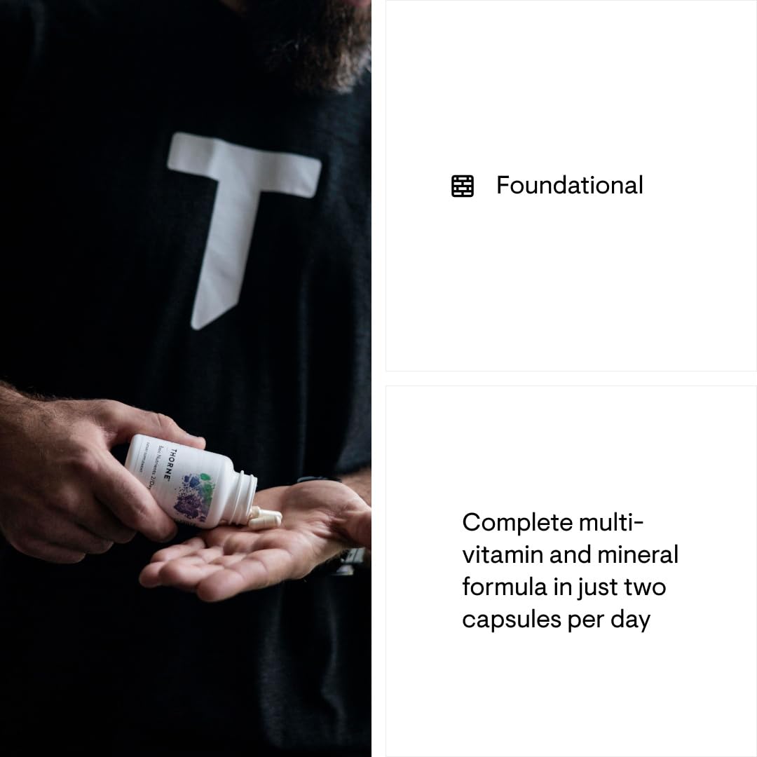 Person holding a bottle of vitamins with text about a complete multivitamin and mineral formula.