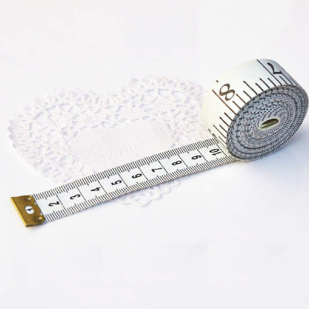 Measuring tape on a textured white surface