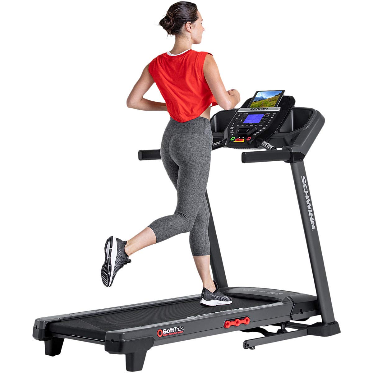 Woman running on a treadmill with a white background