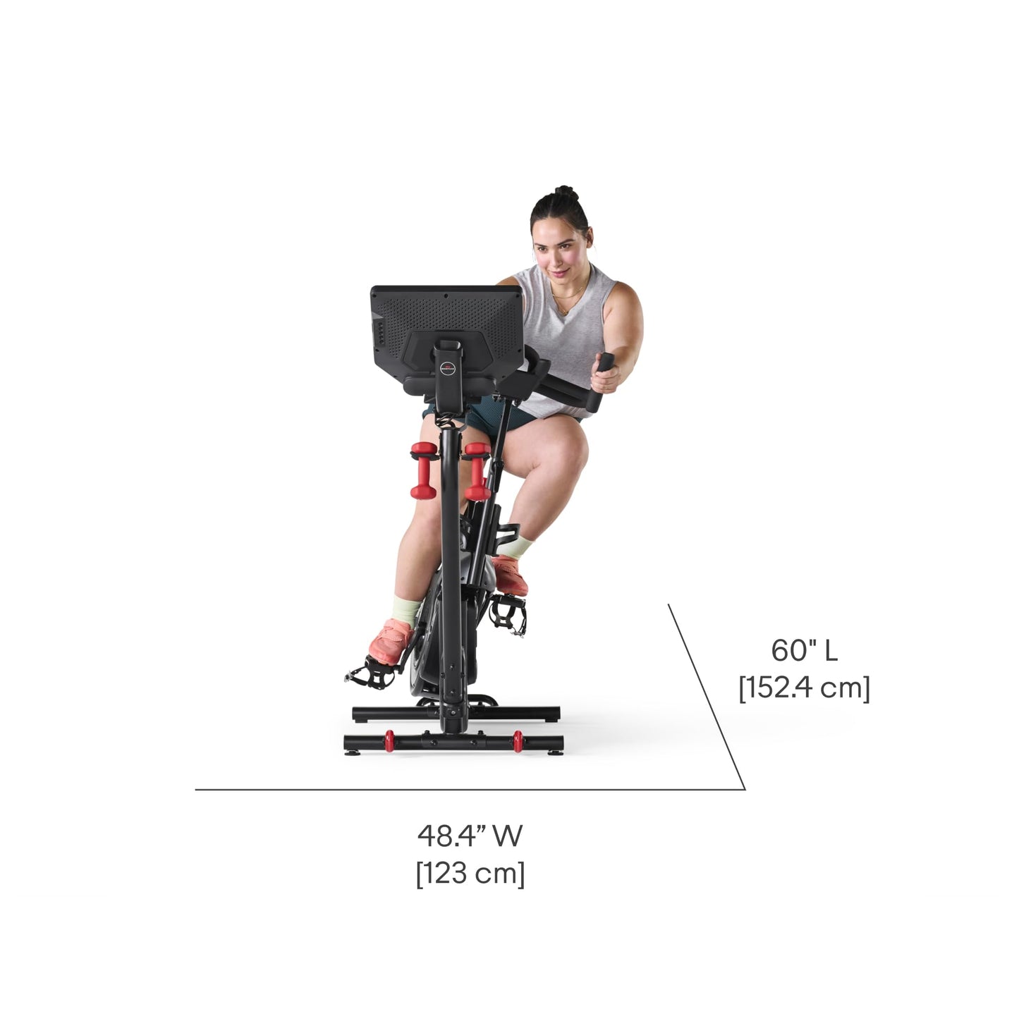Woman using a stationary bike with dimensions labeled on a white background