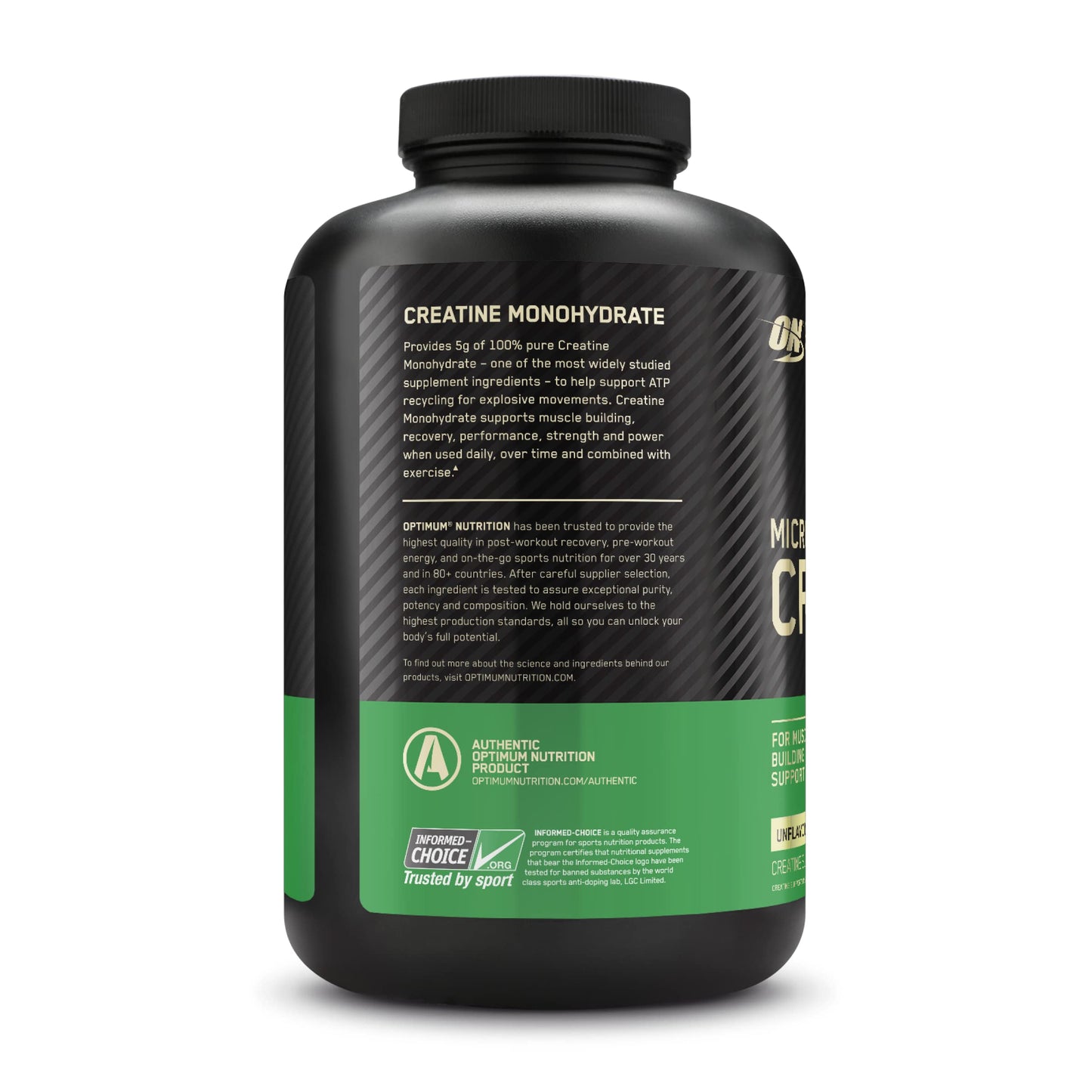 Black supplement bottle with green label on a white background