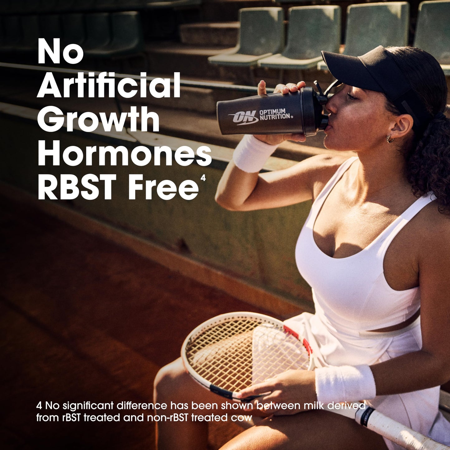 Woman holding a protein shake and tennis racket with text about hormone-free milk.