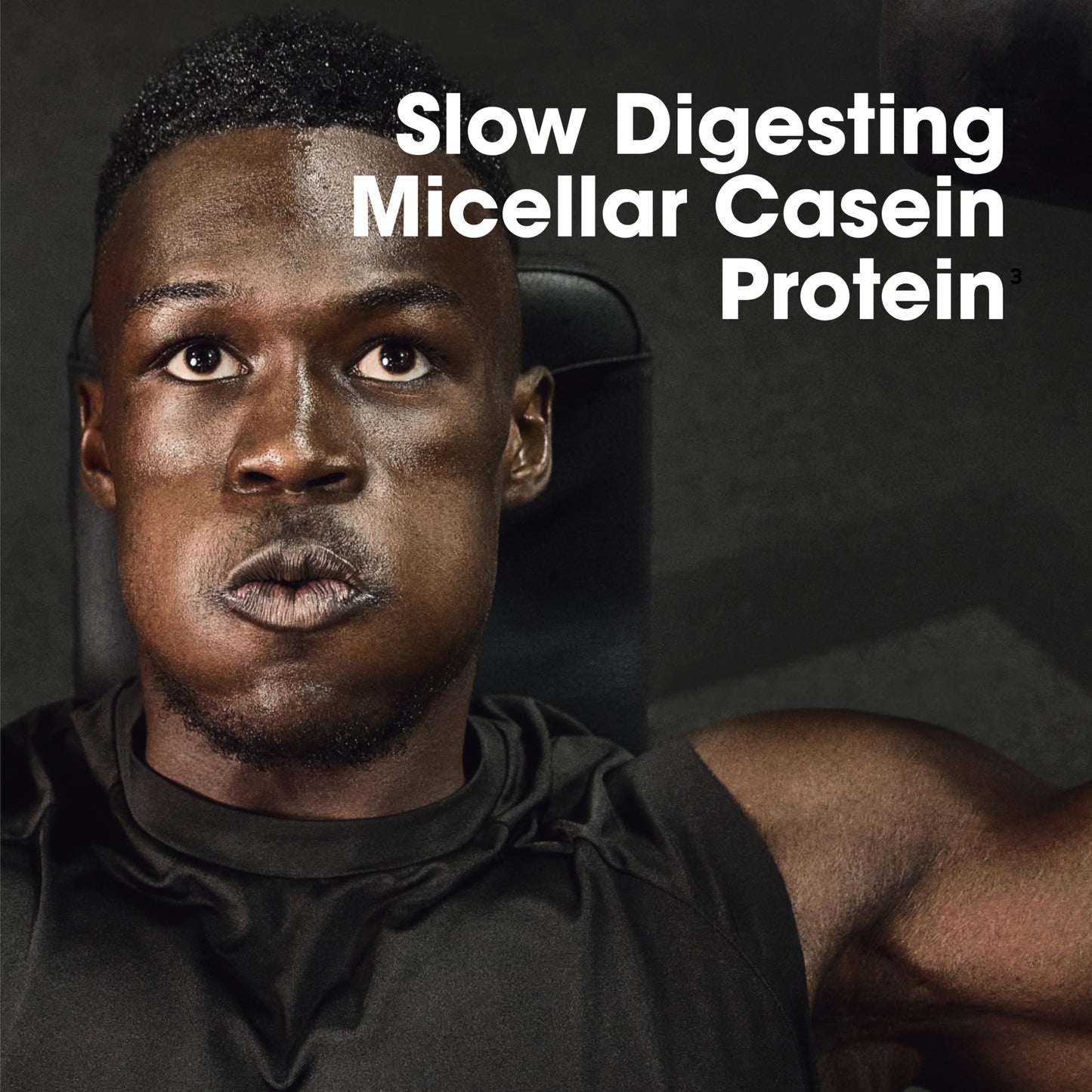 Man with a muscular arm and text about slow digesting micellar casein protein on a dark background