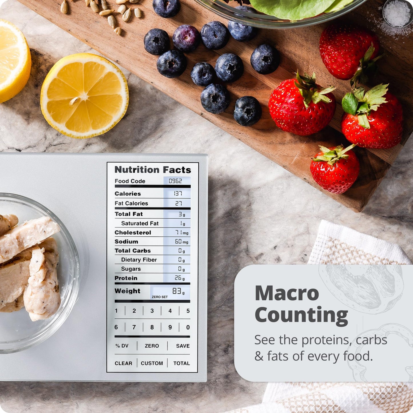 Nutrition facts app on a digital display with fruits and food items on a marble surface