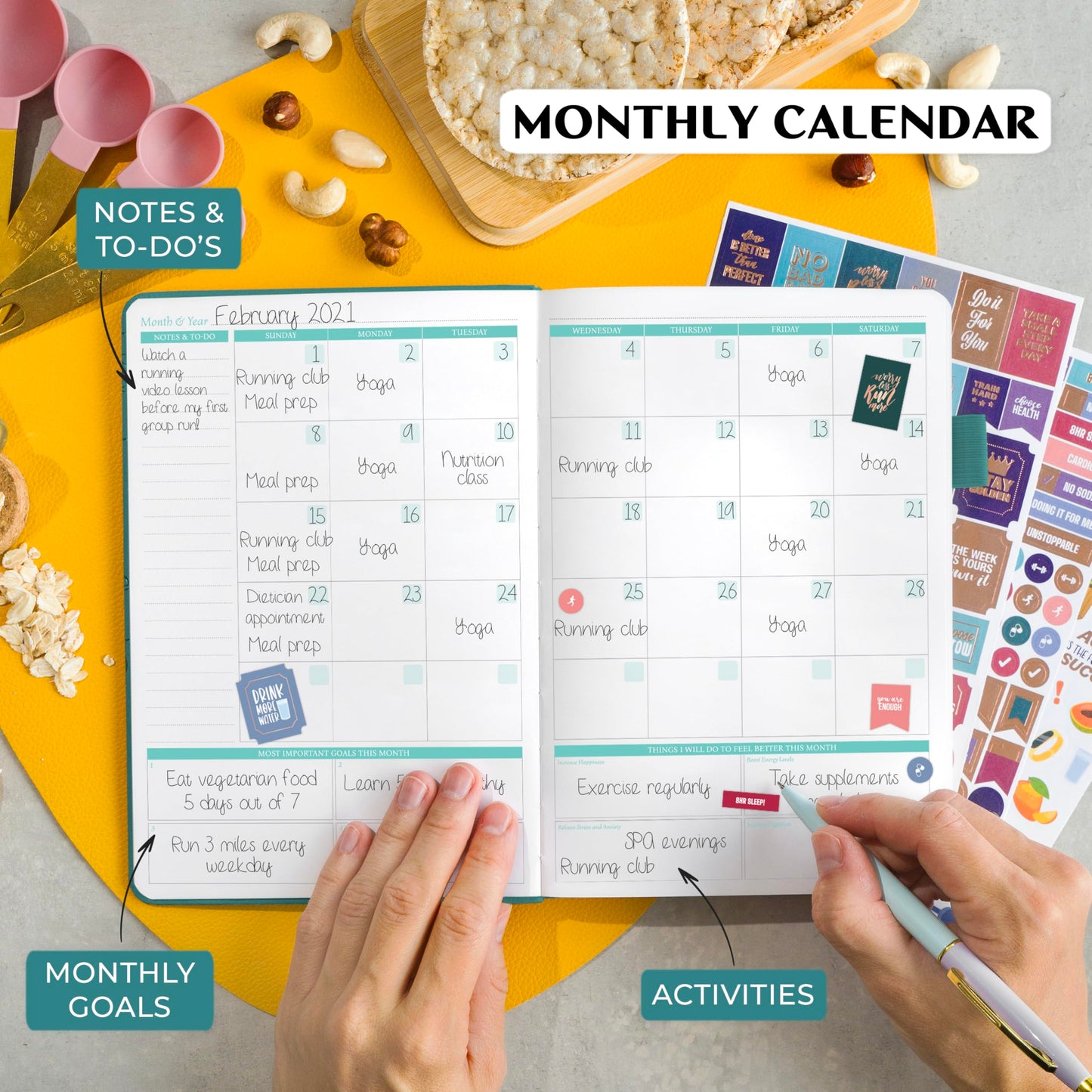 Monthly calendar with notes and activities on a yellow surface with decorative items.