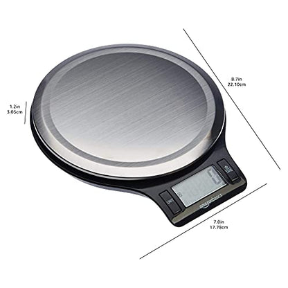 Digital kitchen scale with a metallic platform on a white background