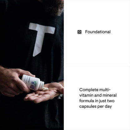 Person holding a bottle of vitamins with text about a complete multivitamin and mineral formula.