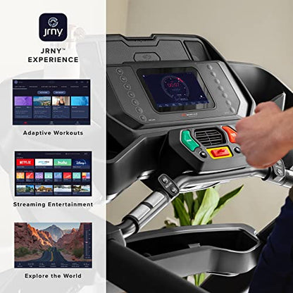 Treadmill with digital display and control panel, featuring JRNY branding and streaming entertainment options.