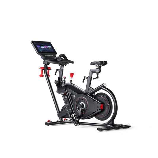 Stationary bike with digital display on a white background