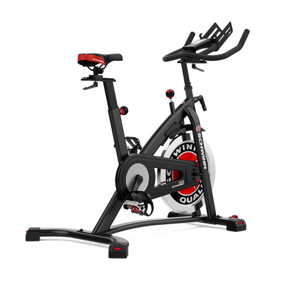 Black and red exercise bike on a white background