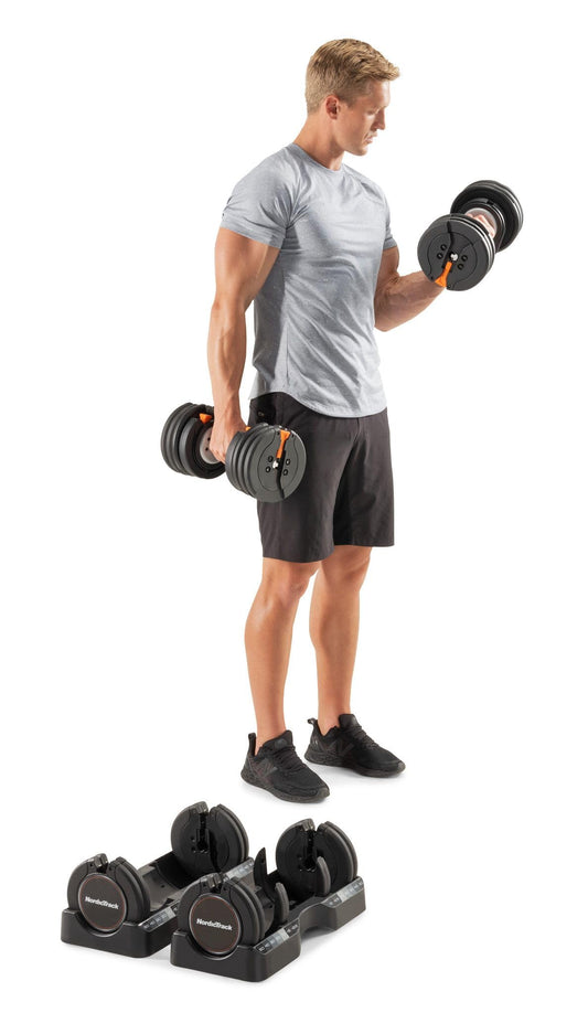 Man exercising with dumbbells on a white background