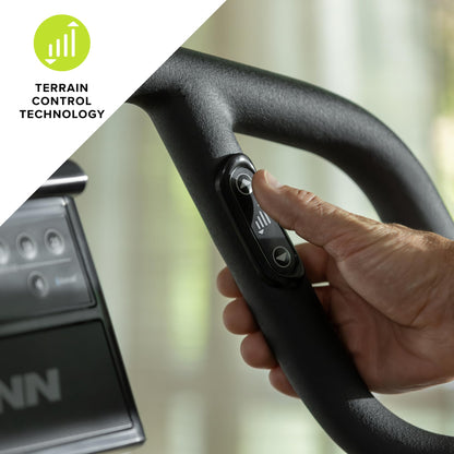 Steering wheel with control buttons and 'Terrain Control Technology' label