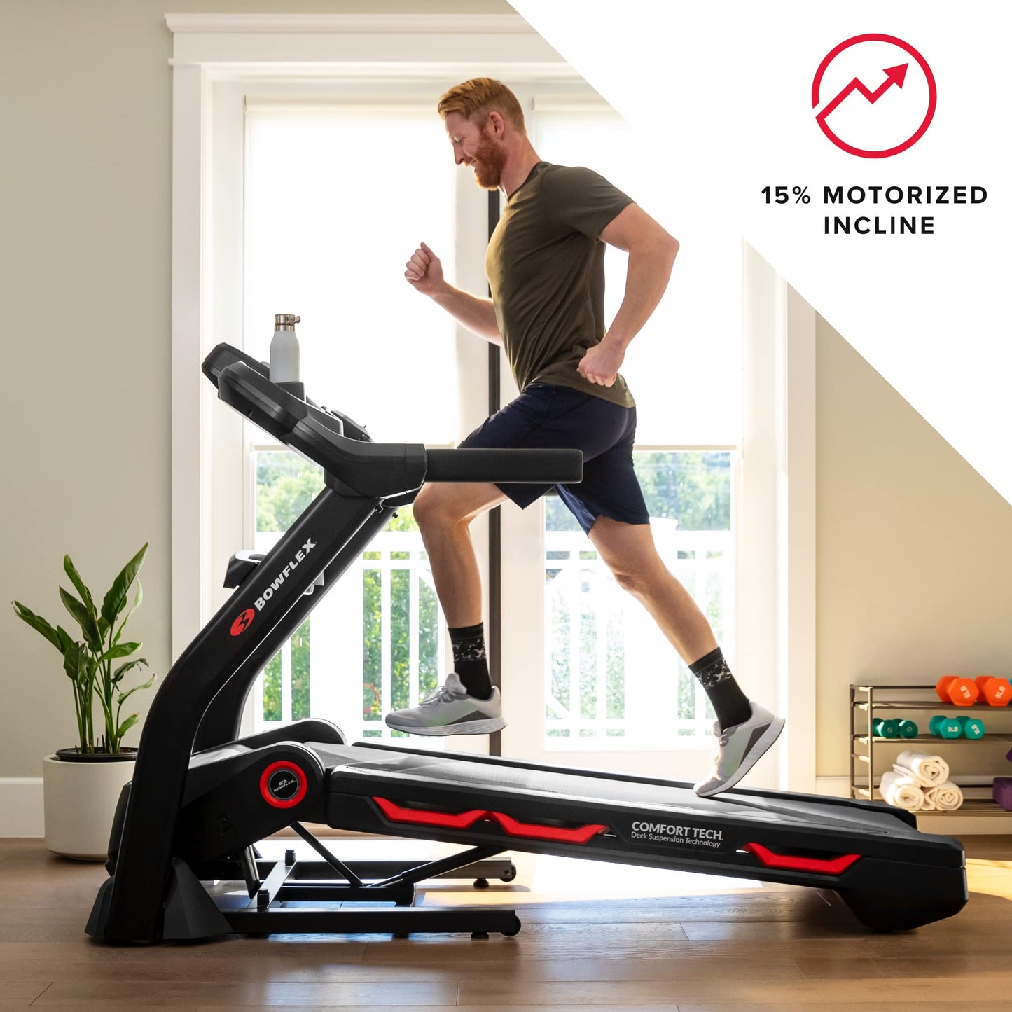 Man using a Bowflex treadmill in a home setting with a 15% motorized incline feature highlighted.