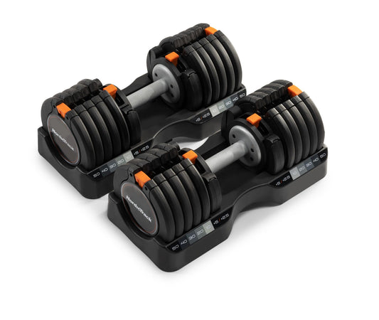 Pair of adjustable dumbbells on a white background