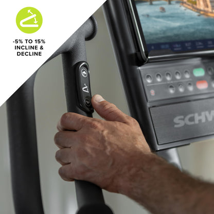 Hand adjusting a treadmill control panel with incline and decline settings displayed.