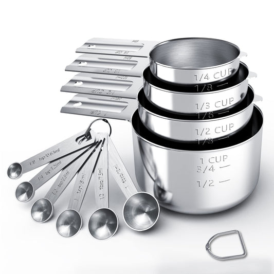 Set of stainless steel measuring cups and spoons on a white background