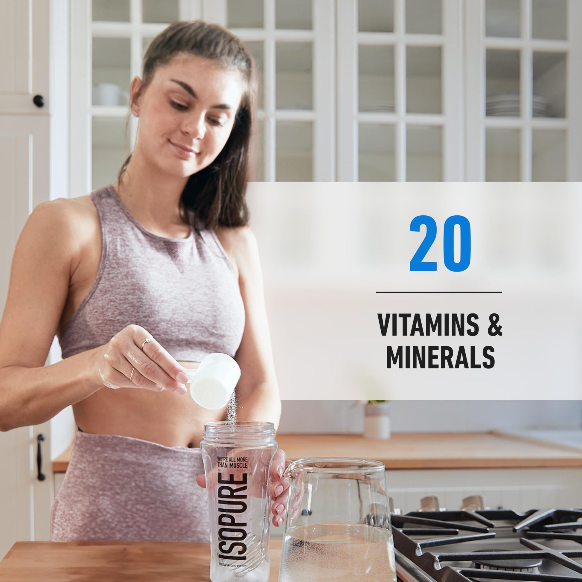 Woman pouring a supplement into a glass of water with ISOPURE branding, set against a kitchen background.