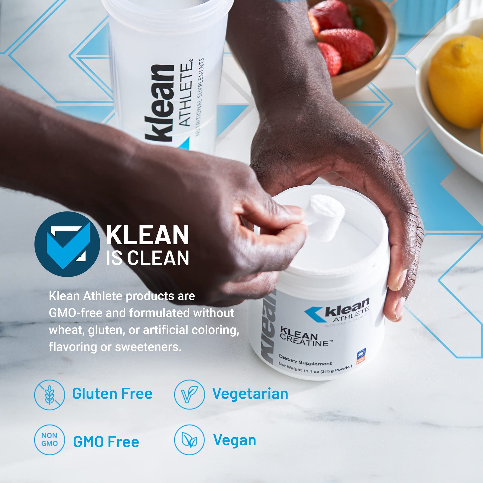 Klean Athlete product with hands holding containers on a table with fruits.