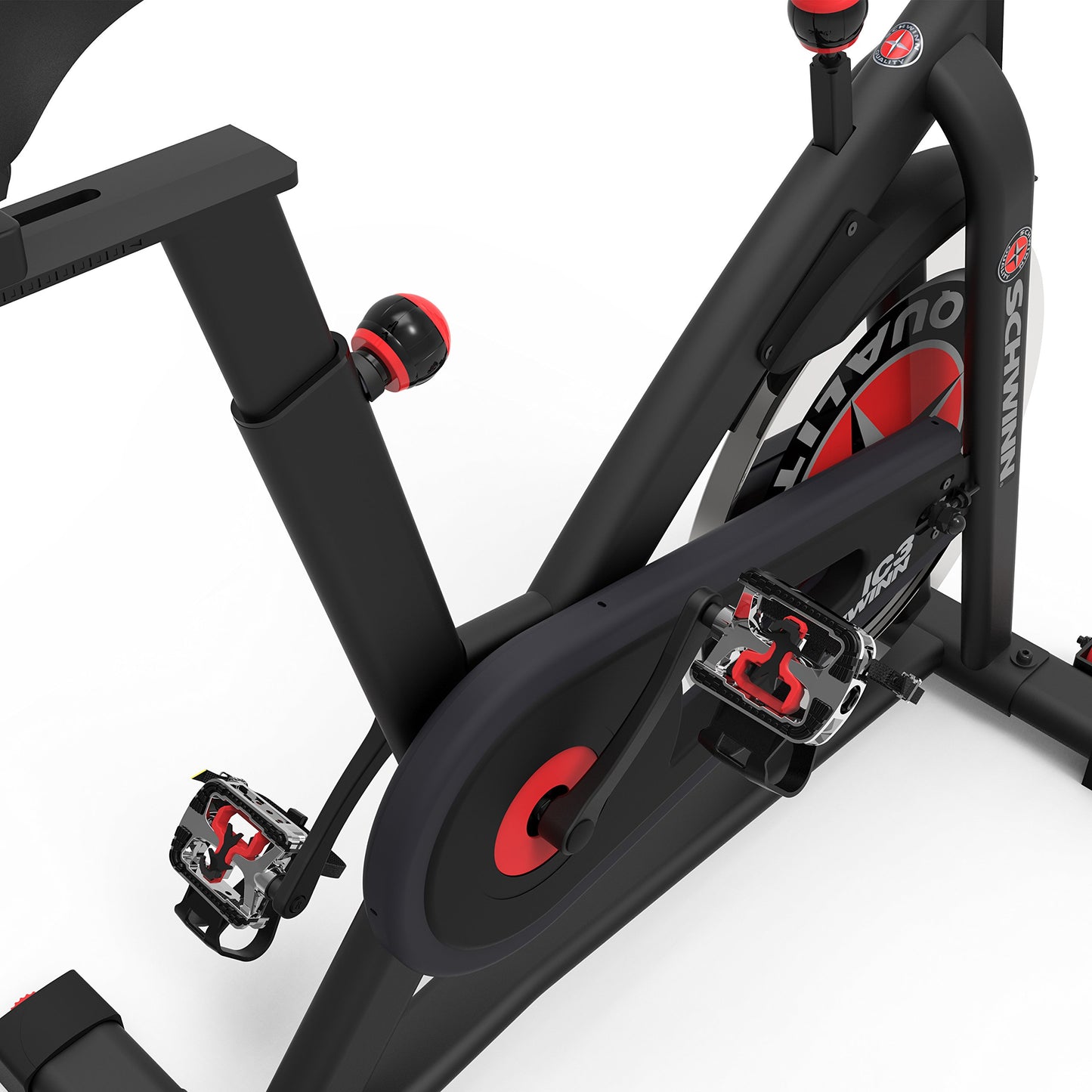 Close-up of a black and red exercise bike on a white background