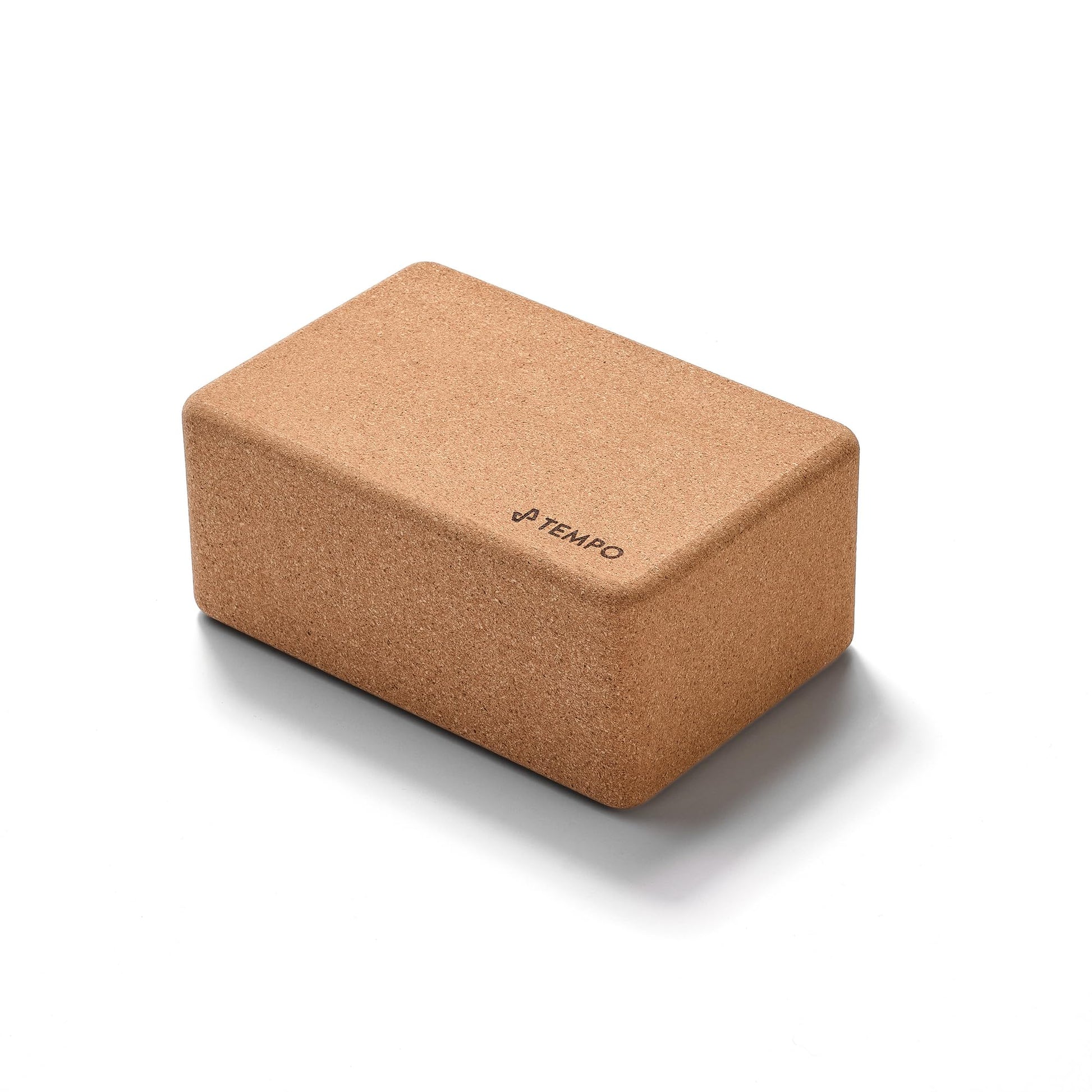 Cork yoga block with 'Tempo' branding on a white background