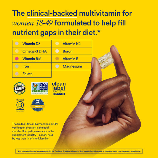 Multivitamin supplement with hand holding a capsule on a yellow background, featuring USP and clean label partner certifications.