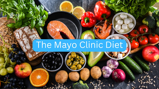Assorted fruits, vegetables, and grains with 'The Mayo Clinic Diet' text overlay on a dark surface.