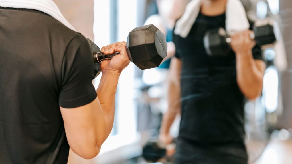 Man lifting dumbbells during a strength training workout