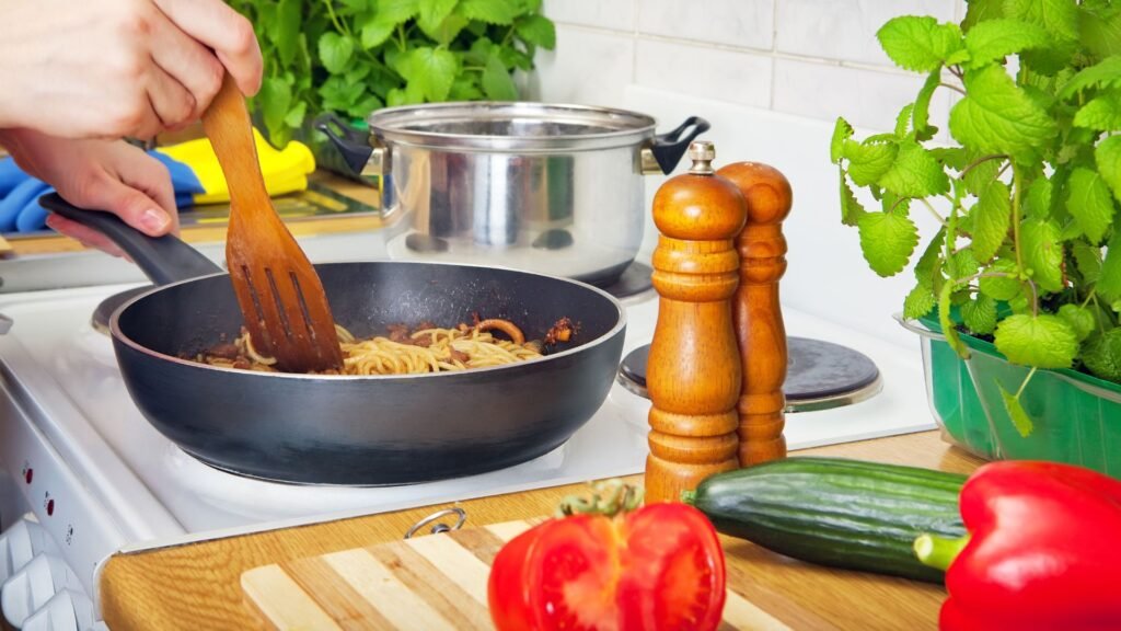Cooking a healthy home-prepared meal with fresh vegetables on the stove