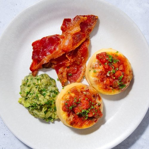 Trifecta breakfast with egg bites, crispy bacon, and guacamole