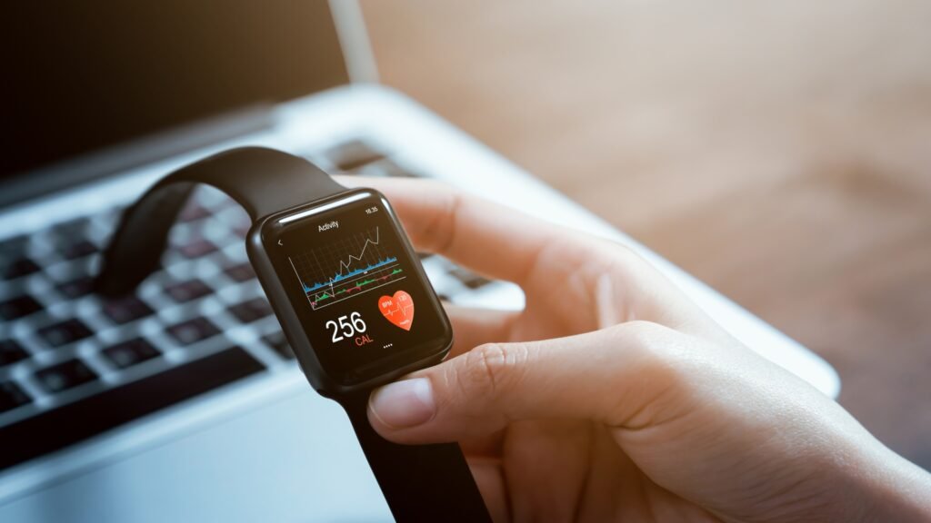 Smartwatch showing calories burned and heart rate on screen