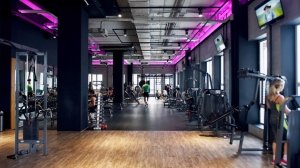 Modern health club gym with strength training and cardio equipment