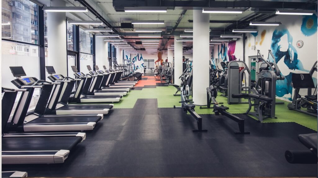 Modern fitness club with treadmills and strength training equipment