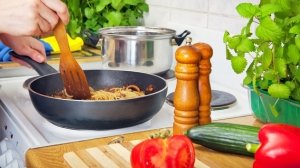 Cooking a healthy home-prepared meal with fresh vegetables on the stove