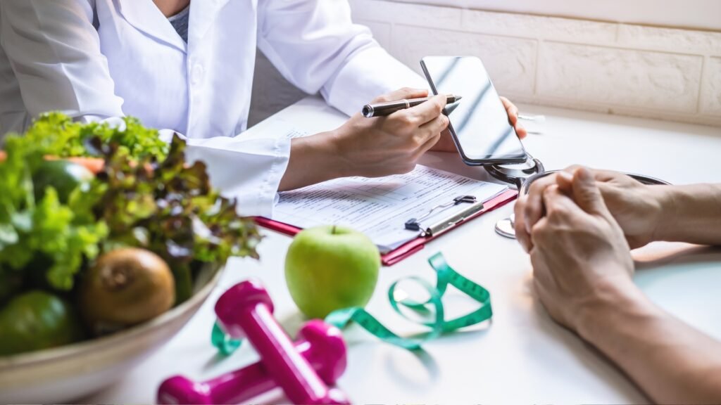 Nutritionist reviewing a weight loss plan with a patient, surrounded by healthy foods and fitness tools