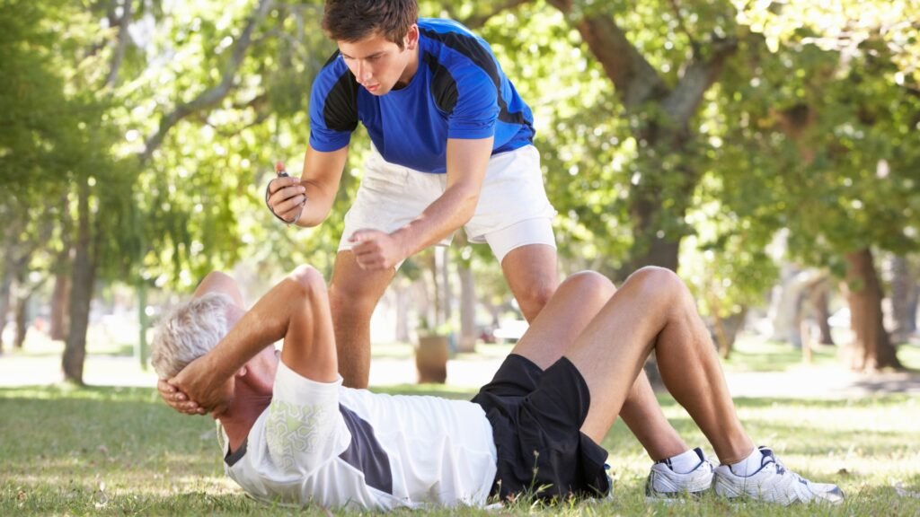 Personal trainer coaching client during outdoor workout
